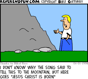 DESCRIPTION: Guy talking to a mountain CAPTION: I DON'T KNOW WHY THE SONG SAID TO TELL THIS TO THE MOUNTAIN, BUT HERE GOES "JESUS CHRIST IS BORN"