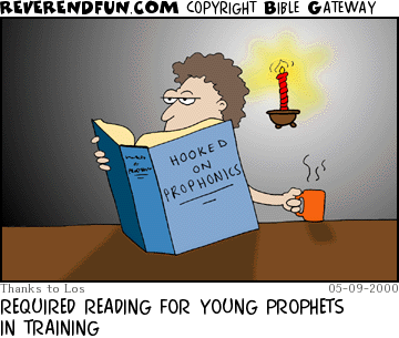 DESCRIPTION: Guy reading book labelled 'Hooked on Prophonics' CAPTION: REQUIRED READING FOR YOUNG PROPHETS IN TRAINING