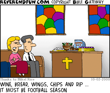 DESCRIPTION: Two folks sitting in church looking at the communion table ... table has all sorts of food on it. CAPTION: WINE, BREAD, WINGS, CHIPS AND DIP ... IT MUST BE FOOTBALL SEASON