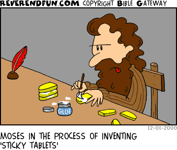 DESCRIPTION: Moses sitting at a table gluing little yellow tablets together CAPTION: MOSES IN THE PROCESS OF INVENTING 'STICKY TABLETS'