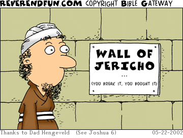 DESCRIPTION: Man looking at sign on wall of Jericho CAPTION: 