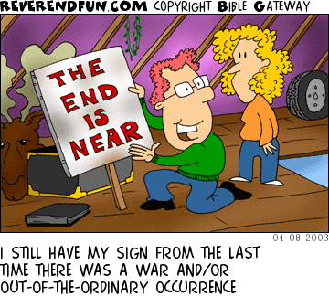 DESCRIPTION: Man in attic holding up &quot;The end is near&quot; sign CAPTION: I STILL HAVE MY SIGN FROM THE LAST TIME THERE WAS A WAR AND/OR OUT-OF-THE-ORDINARY OCCURRENCE
