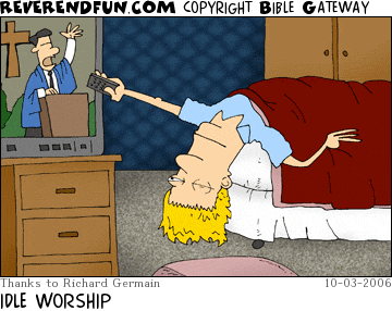 DESCRIPTION: Man laying in bed upside down and flipping on the television, which is showing a televangelist CAPTION: IDLE WORSHIP