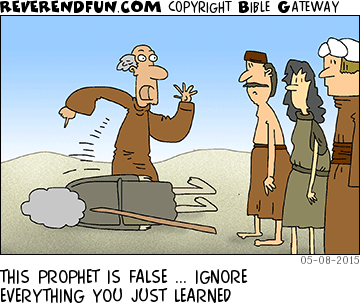 DESCRIPTION: People looking on as a cardboard prophet falls over CAPTION: THIS PROPHET IS FALSE ... IGNORE EVERYTHING YOU JUST LEARNED